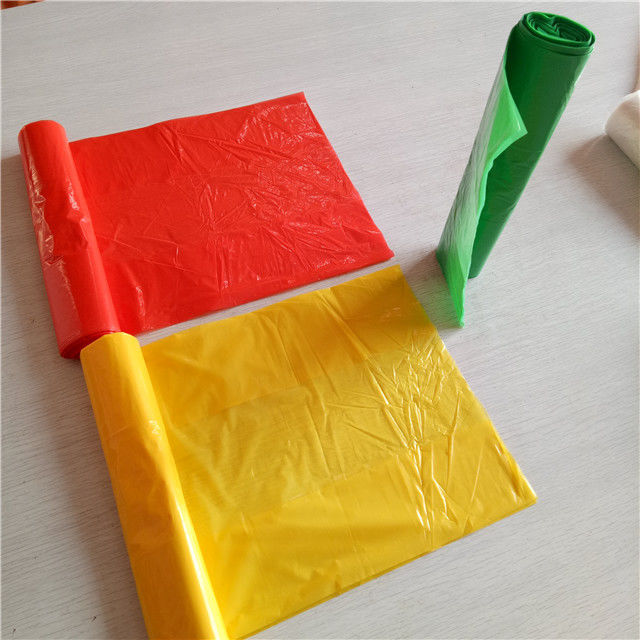 red colored trash bags